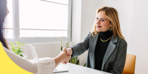 woman shaking hands in interview